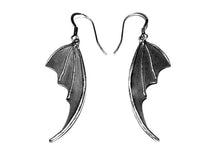 bat wing silver earrings on white background