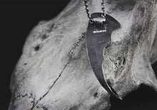 bat wing silver pendant on a cow skull